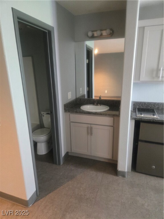 Bathroom featuring vanity and tile patterned floor