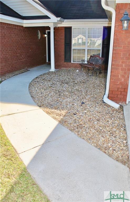 Beautiful walk to the entrance of this home provid