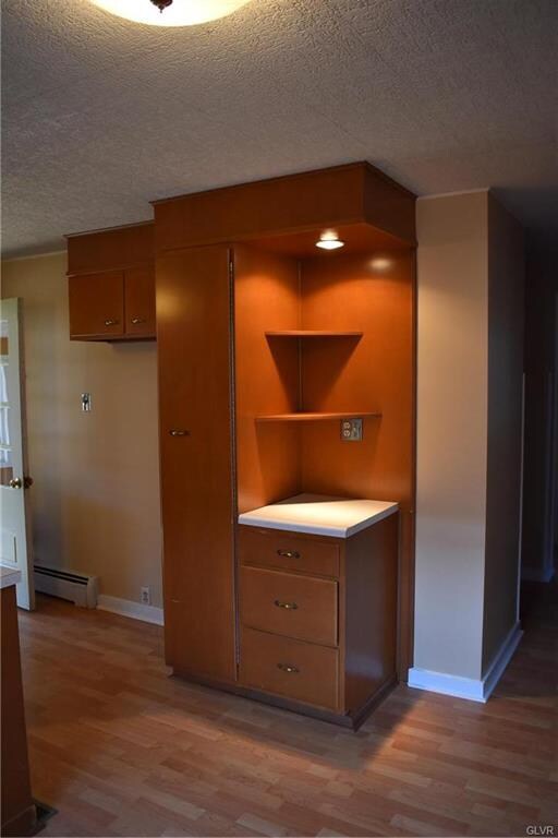 Pantry door opens to reveal pull out shelving.