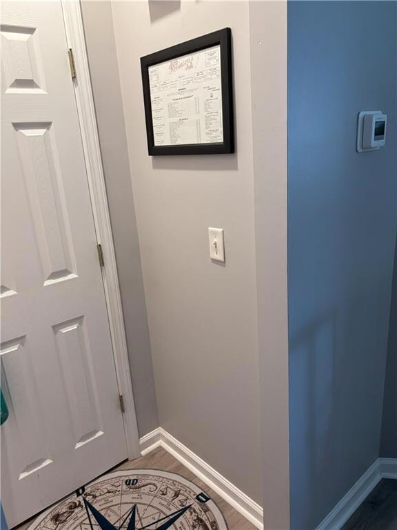 Detailed view of baseboards and wood finished floors