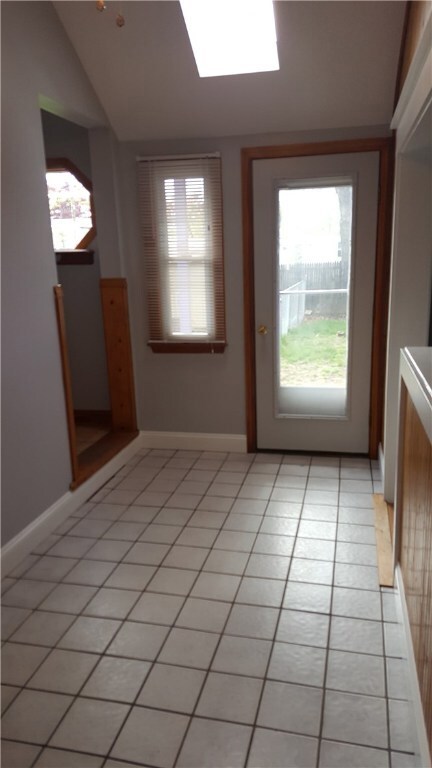 Tiled Entry Hall/Mud Room and Back Yard Exit Door