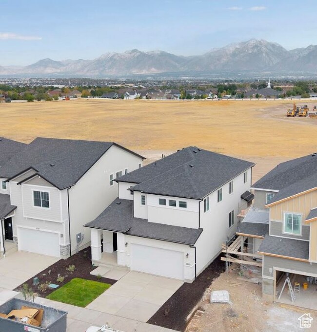 Aerial view of residential area featuring a mountain backdrop