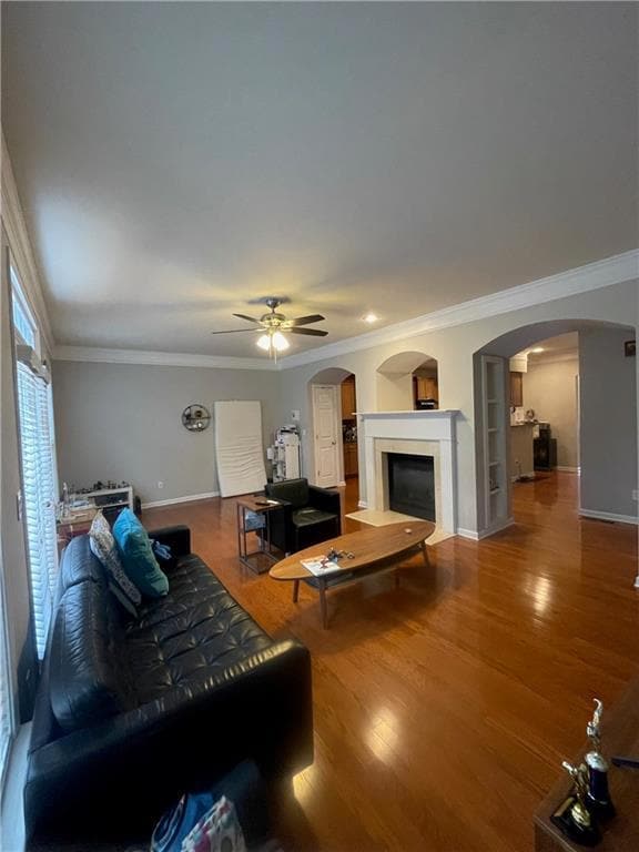 Living room featuring ornamental molding, a ceilin
