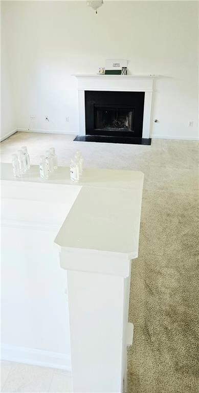 Detailed view of a fireplace and baseboards