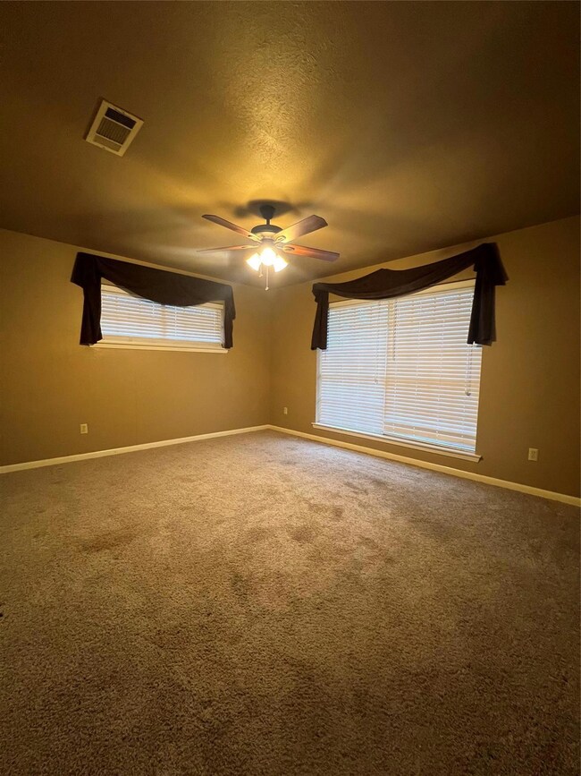 Bedroom #1  featuring ceiling fan, carpet floors, 