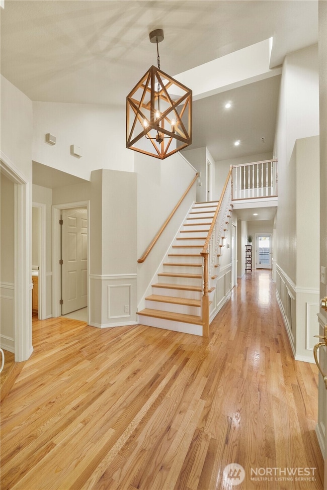 Beautiful Entry with custom staircase- check out the lighting!