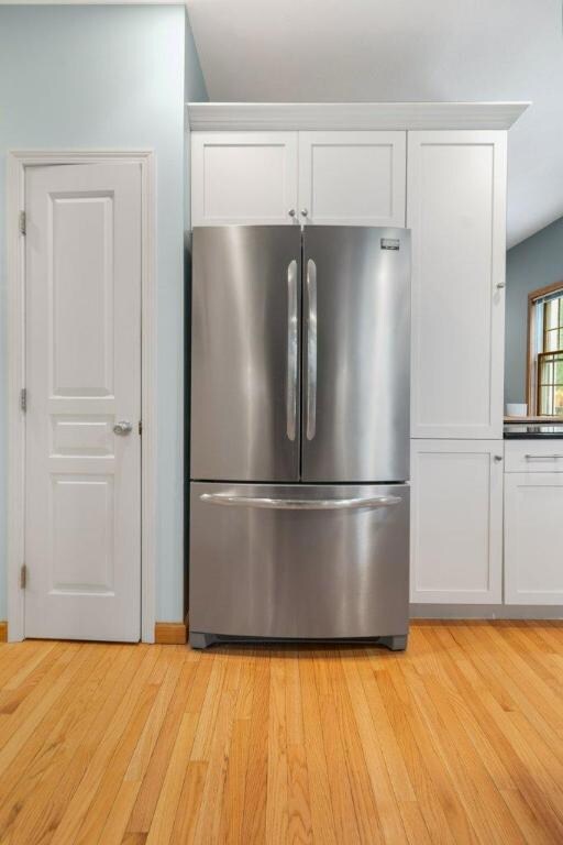 Pantry with French-door refrigerator.