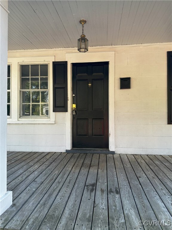 Property entrance featuring a deck