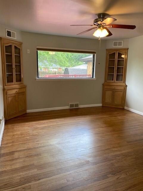 Dining area with real wood floors and built in cor