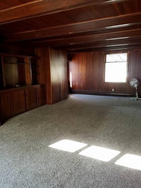 Large living room with built in entertainment area