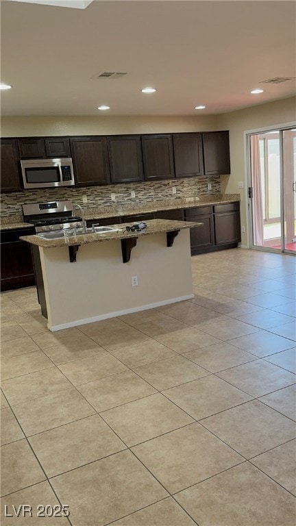 Kitchen featuring appliances with stainless steel