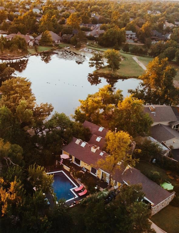 View of property location featuring a large body of water and nearby suburban area