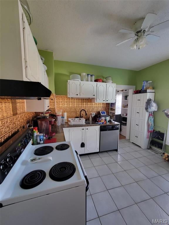 Kitchen with electric range, a sink, stainless steel dishwasher, white cabinets, and light tile patterned flooring