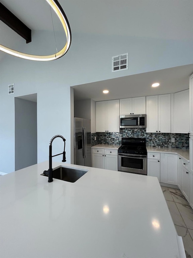 Kitchen featuring appliances with stainless steel