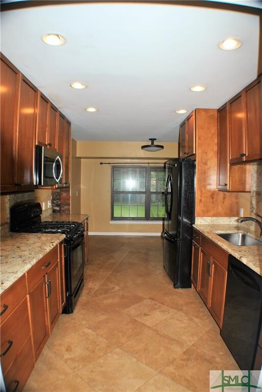 Kitchen with Travertine flooring, Granite counter 