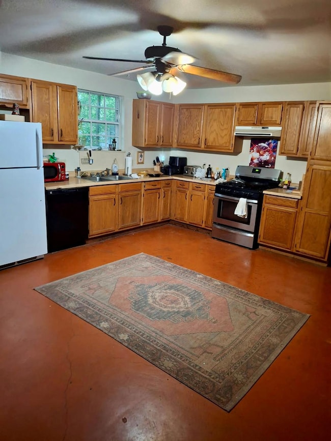 Kitchen with freestanding refrigerator, black dis