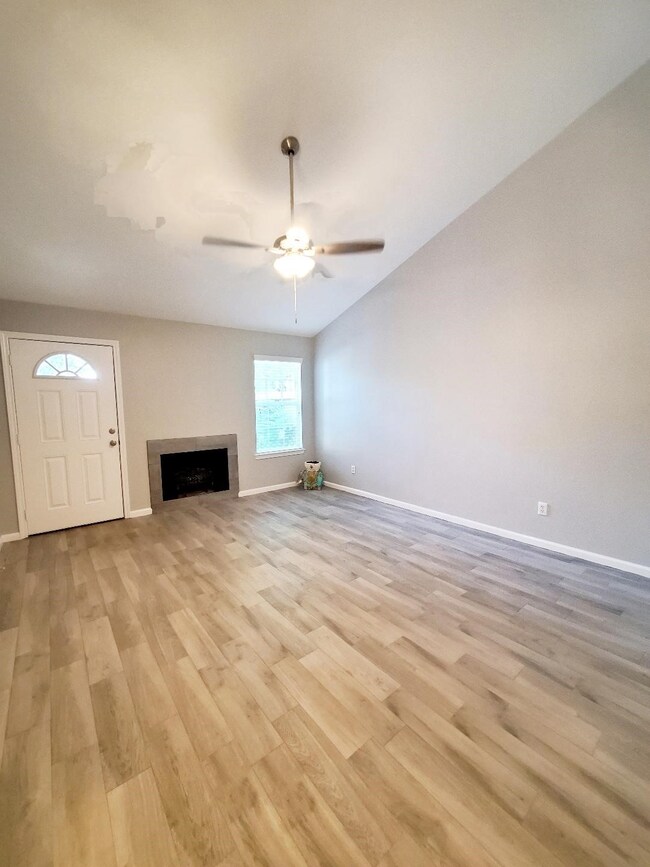 Den with wood burning fireplace!