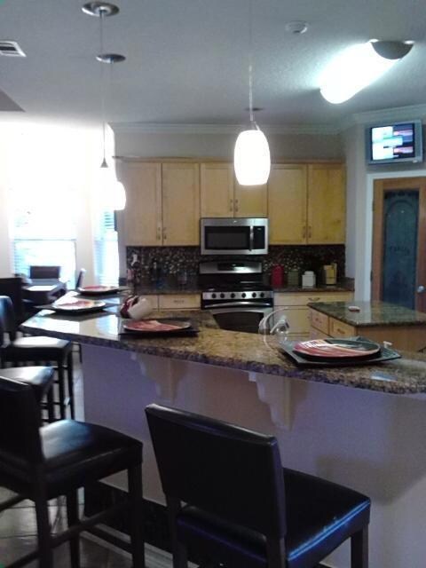 View of kitchen leading to breakfast area for spen