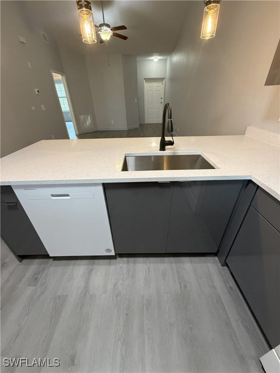 Kitchen with a sink, dishwasher, light stone count