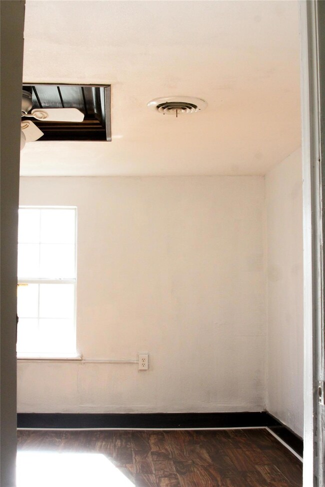 Spare room with a ceiling fan, visible vents, and 