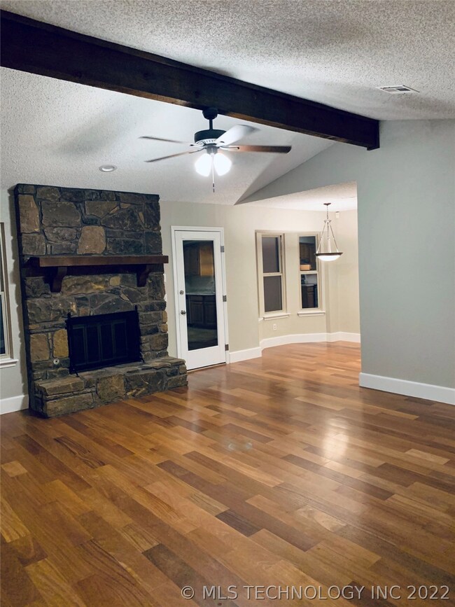 Living room w/ vaulted beamed ceiling