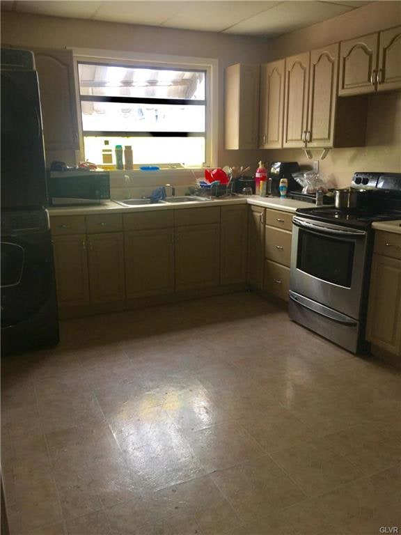 spacious kitchen has a mudroom/porch area that lea