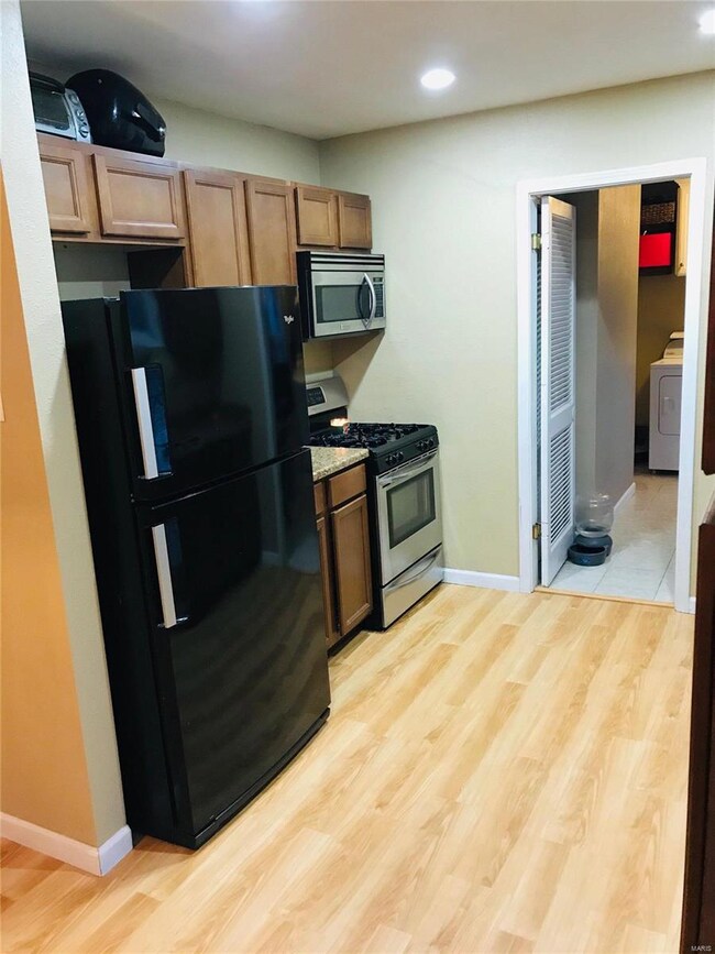 Updated kitchen with custom cabinets, newer Frigid