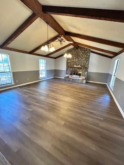 Unfurnished living room with vaulted ceiling with 