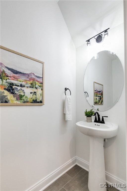 Bathroom with tile patterned flooring