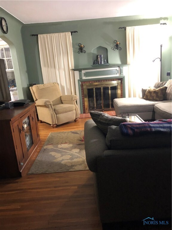 Gorgeous original hardwood floors, fireplace with