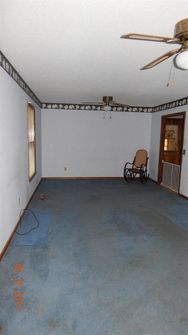 The oversized formal living room offers a large space for family gatherings....