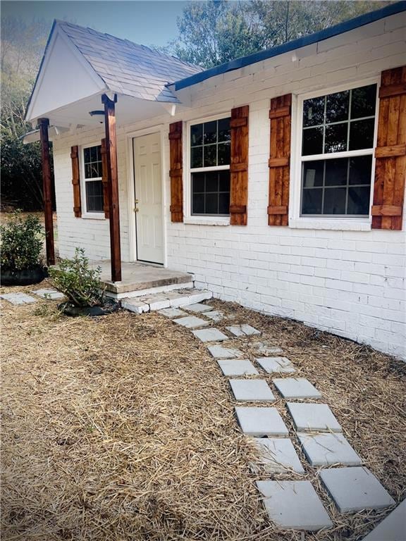 View of front of property featuring brick siding