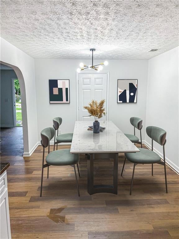 Dining space with arched walkways, dark wood-type 