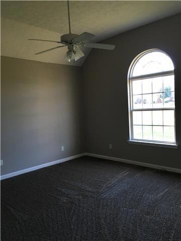 Master bedroom with raised ceiling and palladium window! 