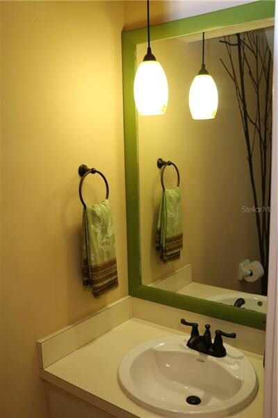 Downstairs Half Bath is just as stylish as the res