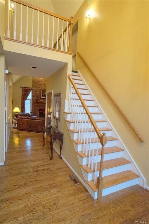 Open foyer with hard wood floors.