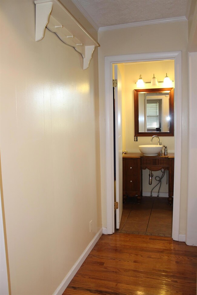 Hallway into bathroom - Laundry Room is to the right.