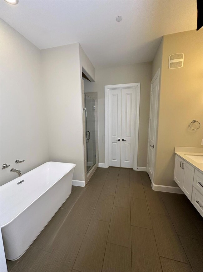 Bathroom with independent shower and bath and vani