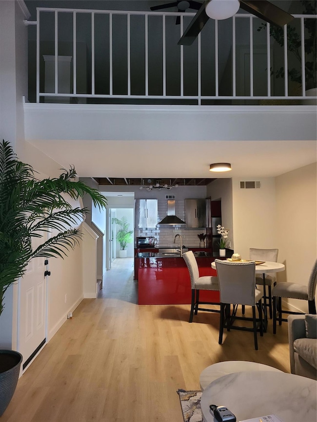 Open Floorplan and view to upstairs loft bedroom