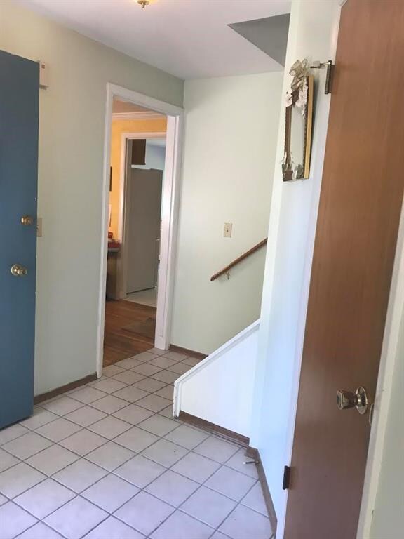 The foyer has tile floor and a hall closet.