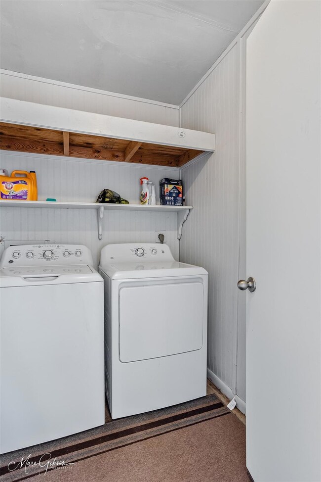 Laundry room featuring laundry area and separate w