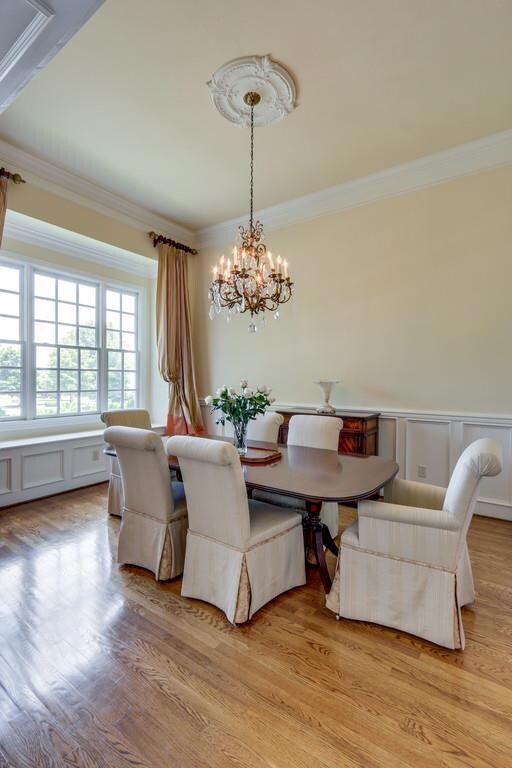 Formal Dining -  •Window Seating Area•Extensive Trim Detail Includes Medallion, Wainscoting, Chair Rail, Crown Molding & Doorways• Hardwood Flooring•Open to Entry & Butler’s Pantry•Freshly Painted•