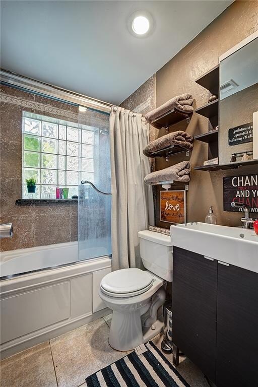 Bathroom with ceramic vessel sink and glass block