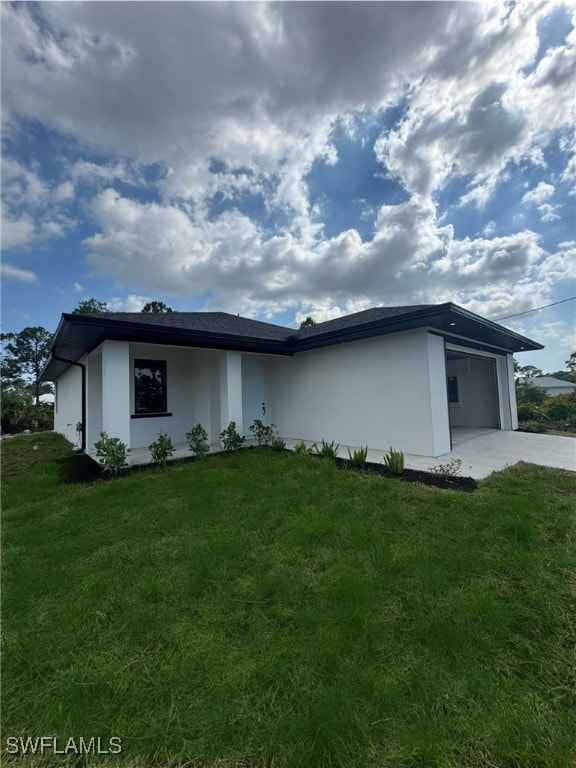 View of front of property featuring concrete drive