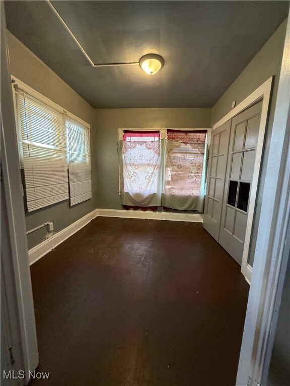 Empty room featuring baseboards