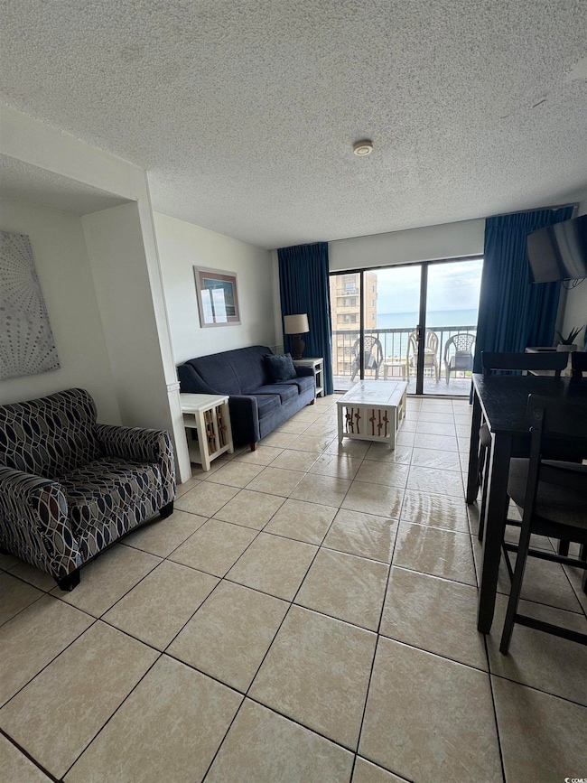 Living room featuring light tile patterned floorin