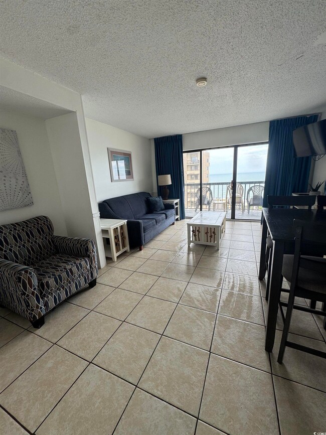 Living room featuring light tile patterned floorin