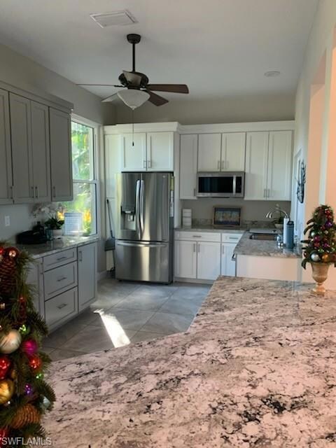 Clubhouse Kitchen featuring sink, ceiling fan, sta