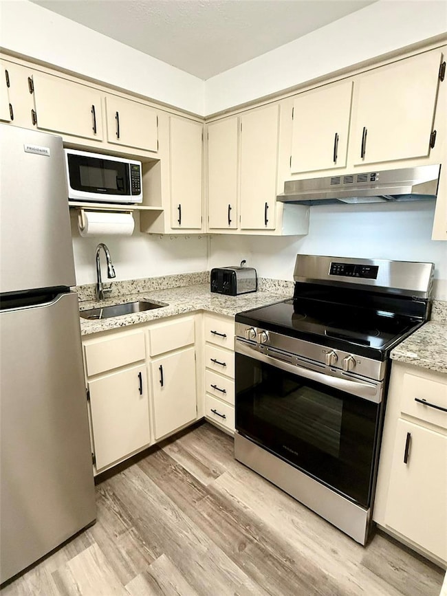 Kitchen features brand new stainless steel appliances,  granite countertops and breakfast bar