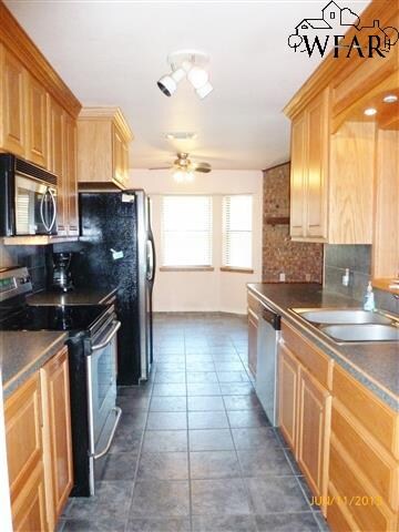At the far end of the kitchen is a breakfast nook 